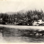 The Powder Factory with a four masted ailing vessel at the dock. In the background can be seen the trestles of the railway. Ca. 1909