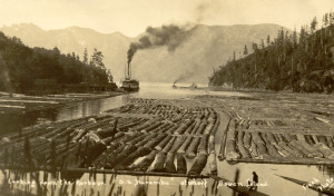 Terminal Steam Navigation Co. steamer “Baramba” entering Snug Cove with log booms in the foreground. ca.1910